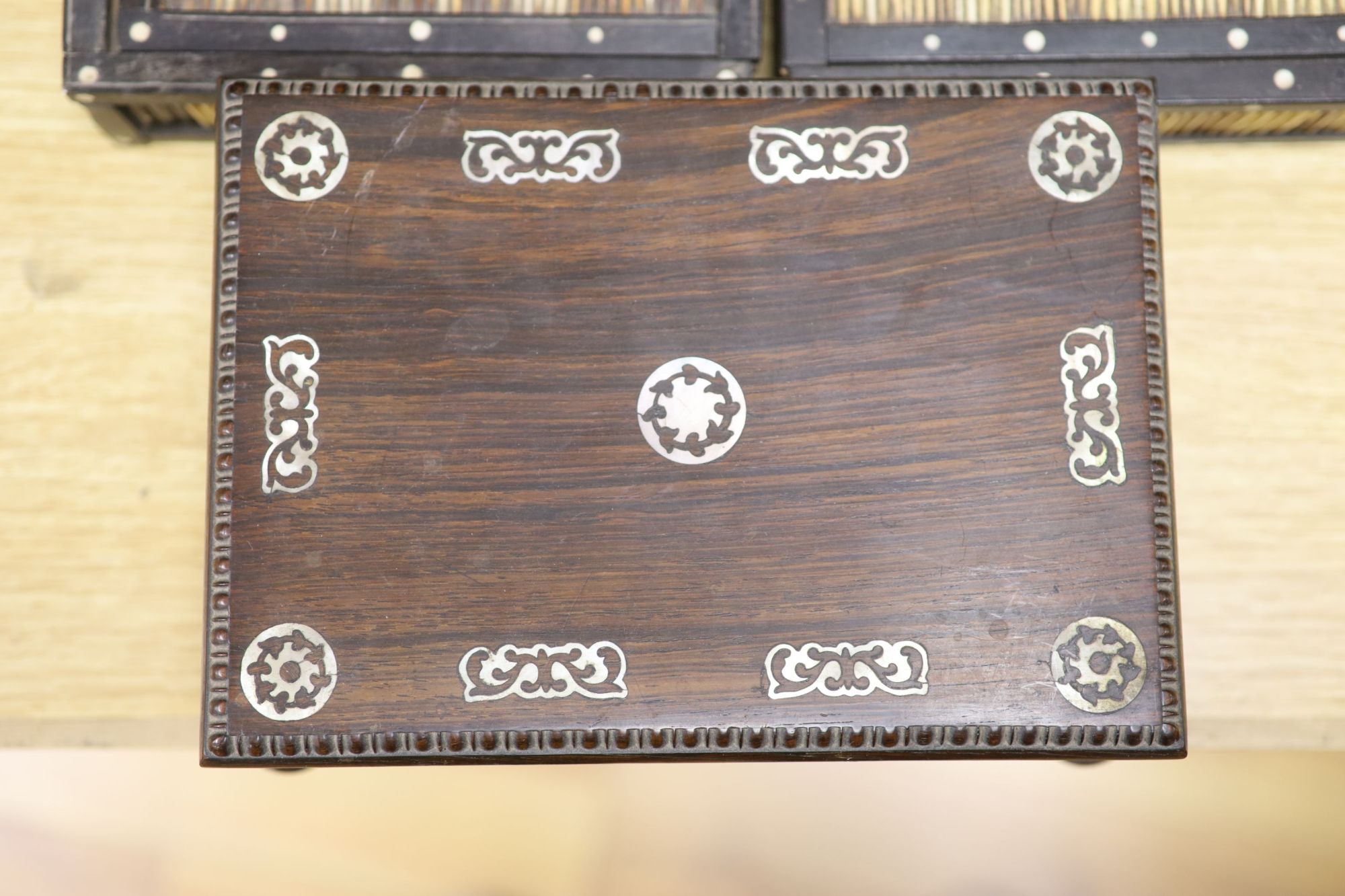 Four Ceylonese quillwork boxes, early 20th century, largest 28 x 19 x 10cm, an Indian inlaid box a Victorian rosewood sewing box